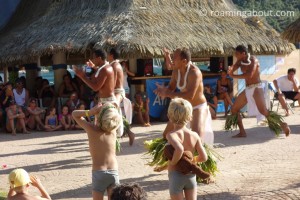 Sailors' children watching a local Polynesian dance